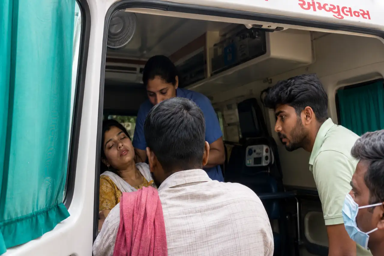 Medical personnel transport victims to an ambulance after an ammonia gas leak