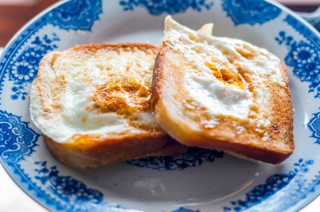 eggy-bread-plate-photographed-with-natural-light-golden-french-toast-with-butter-egg-breakfast-with-bread-english-breakfast-healthy-breakfast-with-eggs_1391-218.jpg
