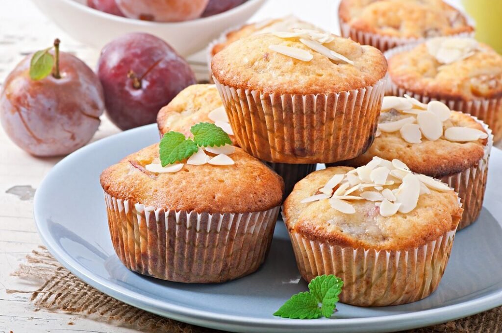 muffins-with-plums-almond-petals-decorated-with-mint-leaves_2829-8609.jpg